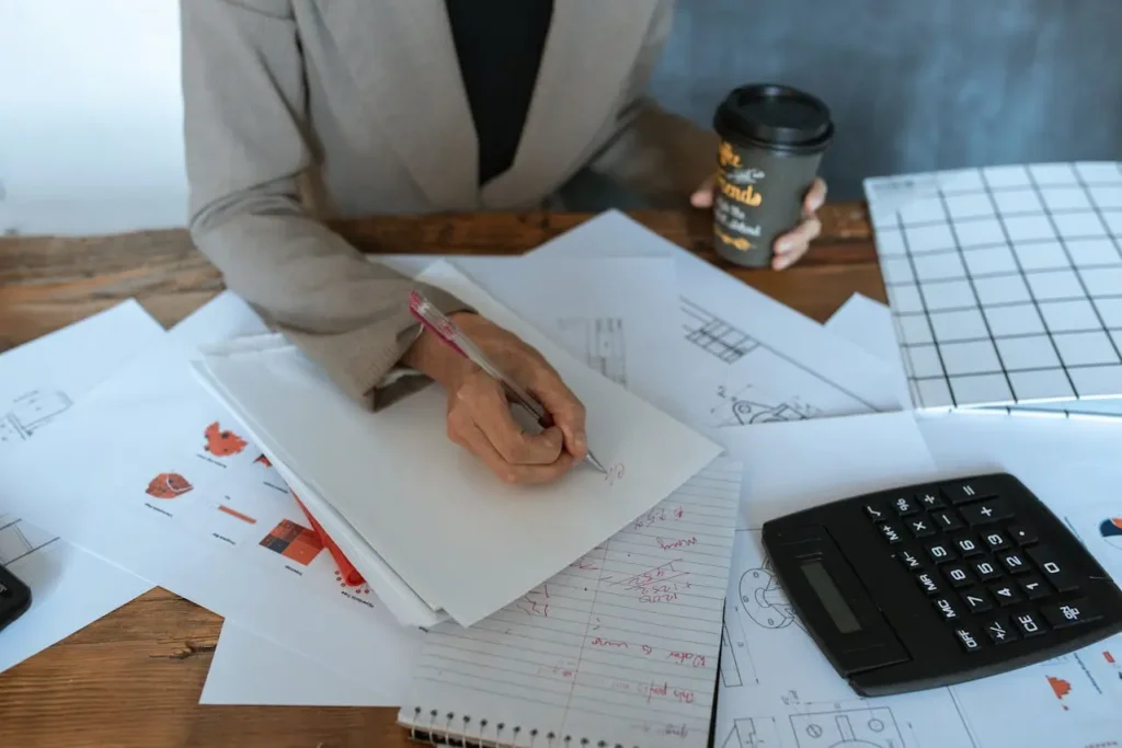 Quantity Surveyors Wellington analyzing project documents and taking notes